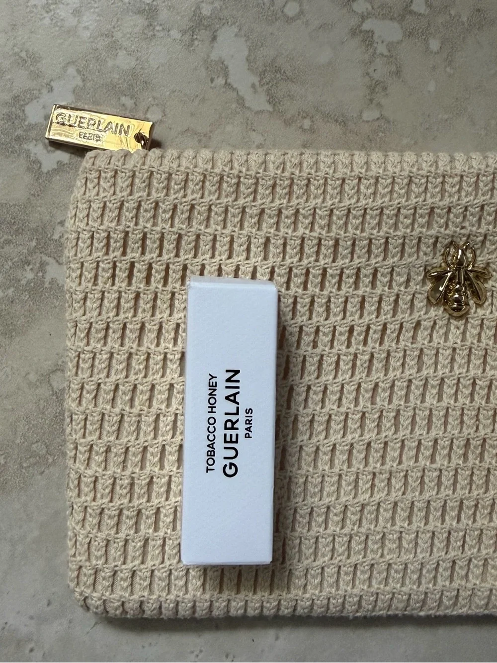 GUERLAIN Beige Woven Clutch with Gold Accent Abeille Royale 🐝